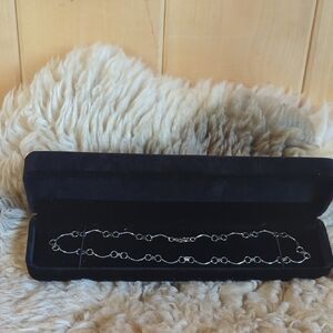 Delicate Silver Necklace with Intricate Chain Design